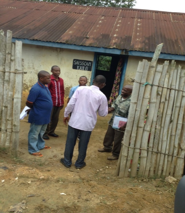 A group of people standing outside a building
Description automatically generated with medium confidence